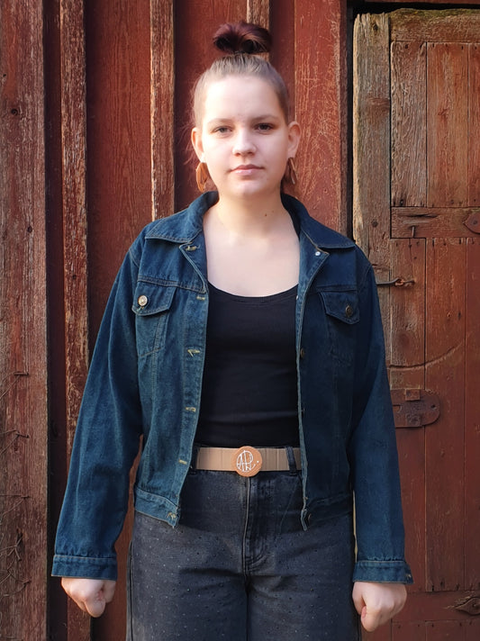 Hand-painted upcycled denim jacket with frog astronaut artwork – wearable art by Hele Artwear.