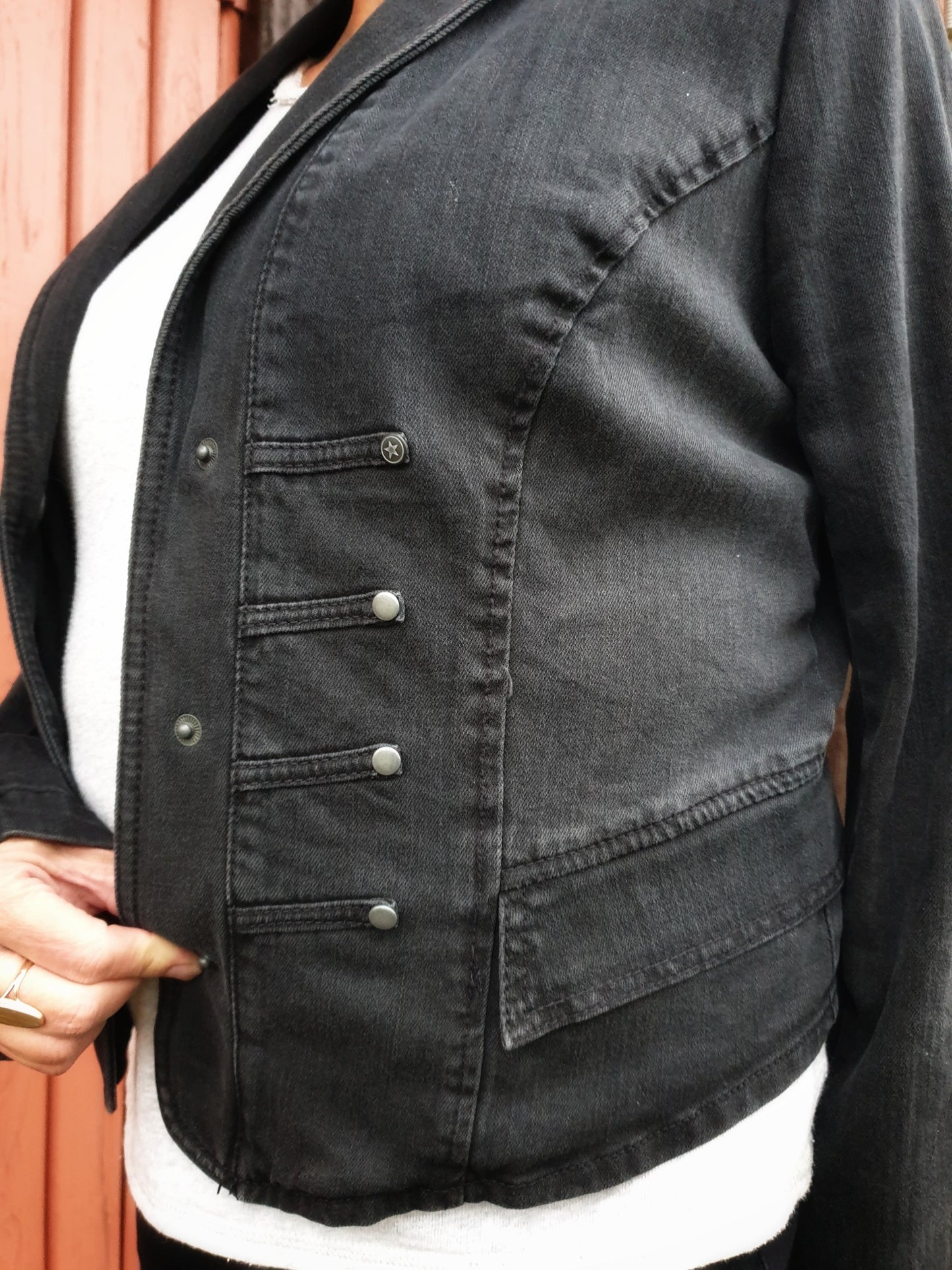 Side view showing the fit and stretch of the Battle Rooster jacket.