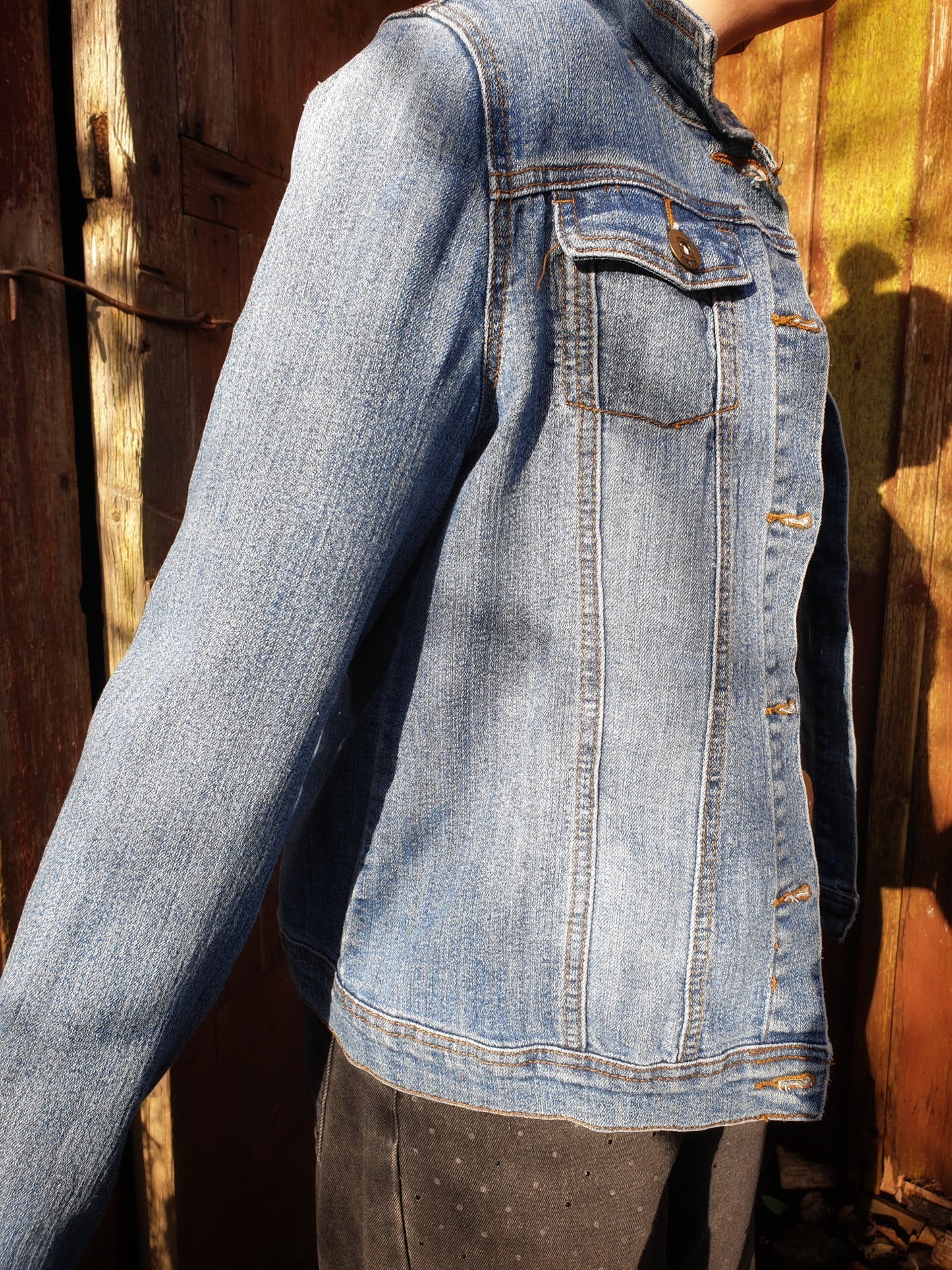 Side angle of the “Jumpy Magic Mushrooms” one-of-a-kind hand-painted denim artwear.