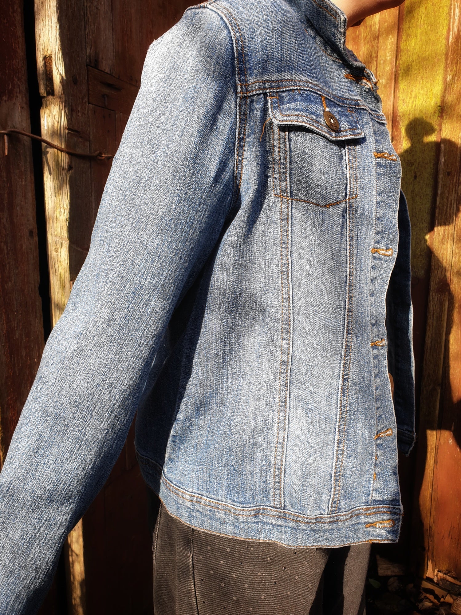 Side angle of the “Jumpy Magic Mushrooms” one-of-a-kind hand-painted denim artwear.