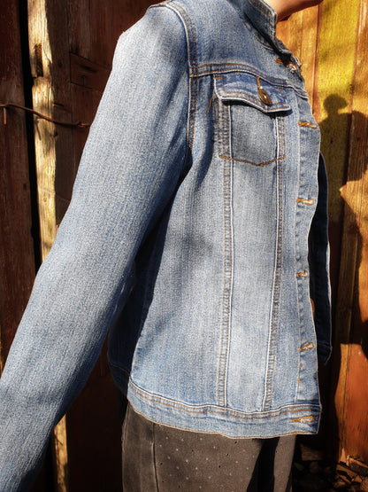 Side angle of the “Jumpy Magic Mushrooms” one-of-a-kind hand-painted denim artwear.