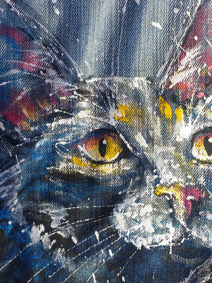 Close-up of the painted cat artwork showing white splashes and expressive brushstrokes.