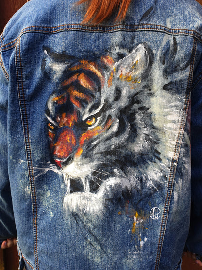 Close-up of the tiger artwork showing vivid color and bleach contrast on denim.