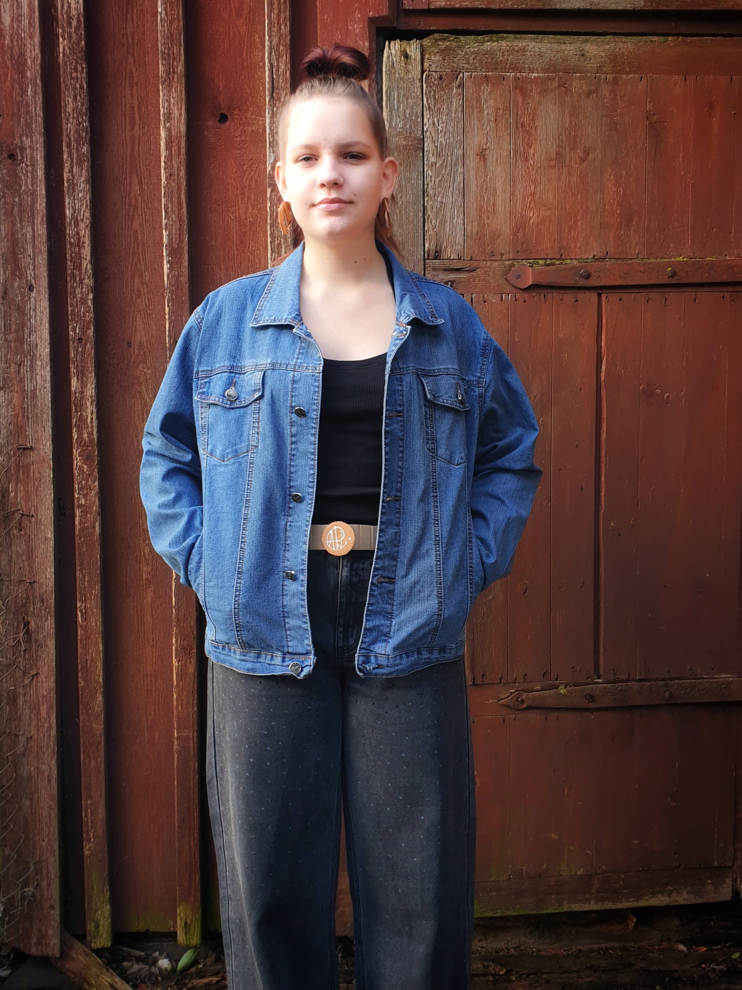 Front view of the lightweight blue denim jacket with a classic fit and four pockets.