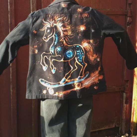 Detail of the horse artwork created using bleach, white, and blue textile paints. Model view