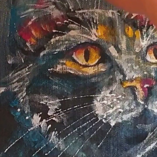 Close-up of the painted cat artwork showing white splashes and expressive brushstrokes. Painting process. Hele Artwear