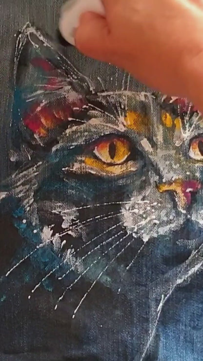 Close-up of the painted cat artwork showing white splashes and expressive brushstrokes. Painting process. Hele Artwear