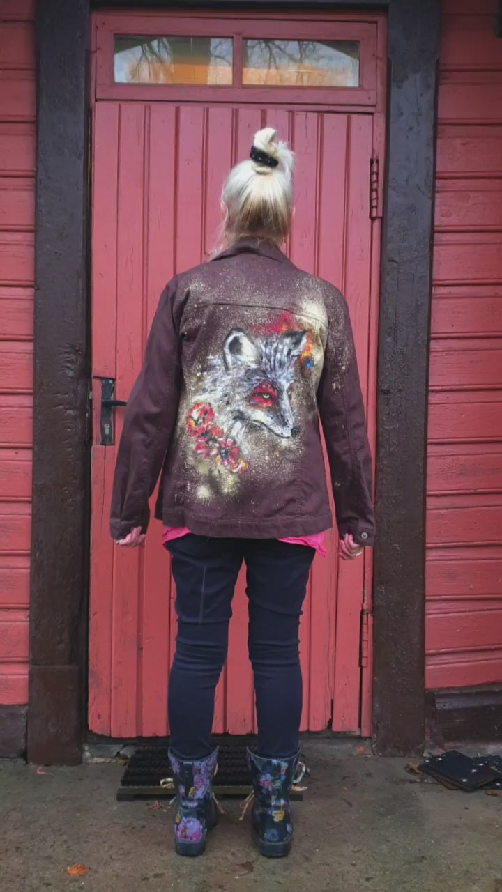 Close-up of the hand-painted fox design with autumn tones. Model view