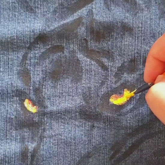 Close-up of the tiger artwork showing vivid color and bleach contrast on denim. Painting. Hele Artwear