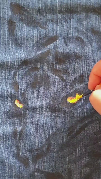 Close-up of the tiger artwork showing vivid color and bleach contrast on denim. Painting. Hele Artwear